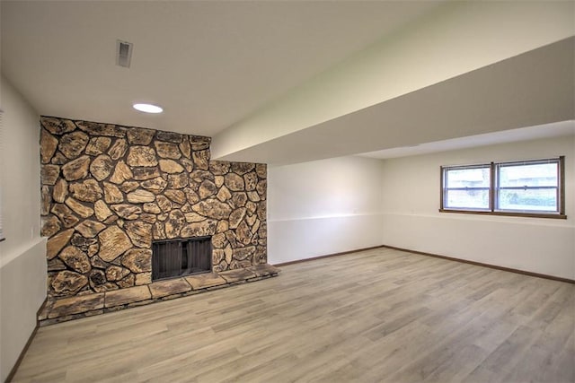 113 White Pines Cir, Decatur, IL 62521 - unfurnished living room with baseboards, wood finished floors, and a fireplace