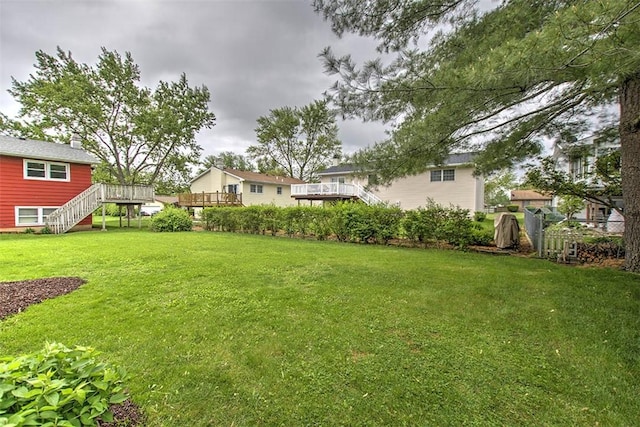 113 White Pines Cir, Decatur, IL 62521 - view of green lawn with stairs and a wooden deck