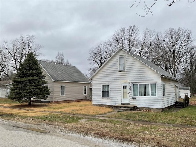 bungalow with a front lawn