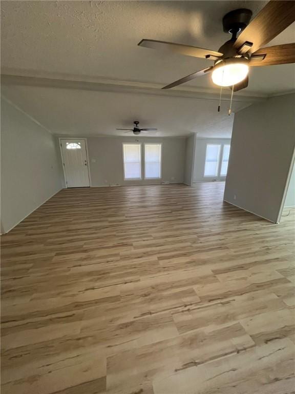 spare room with ceiling fan and light wood-style flooring
