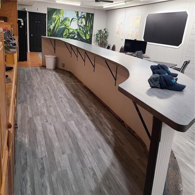interior space with wood finished floors and ceiling fan