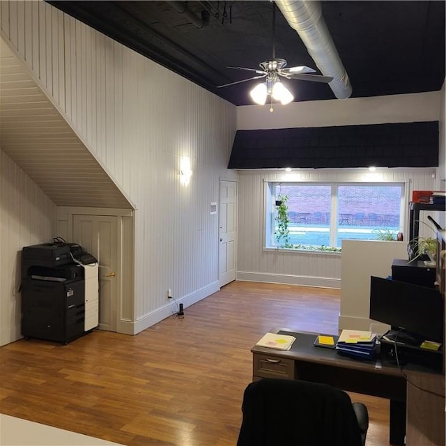 office featuring baseboards, wood finished floors, and a ceiling fan