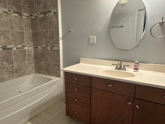 full bath with tile patterned floors, vanity, and bathtub / shower combination
