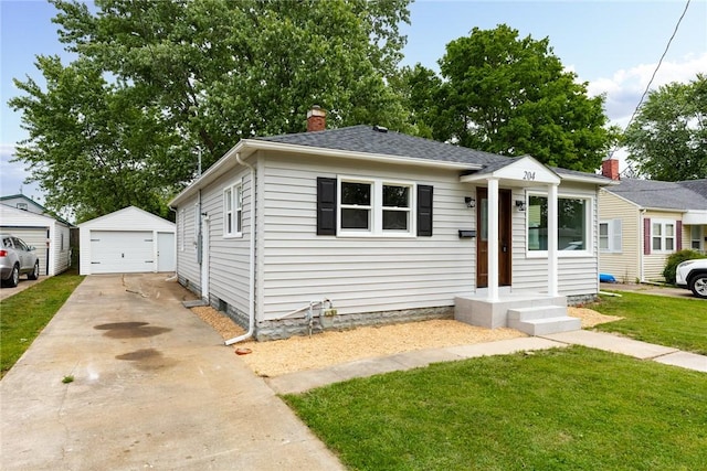 204 W Eiche Ave, Effingham, IL 62401 - bungalow featuring a detached garage, a front yard, a chimney, an outdoor structure, and a shingled roof
