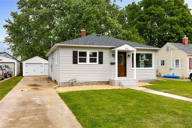 204 W Eiche Ave, Effingham, IL 62401 - bungalow-style home with a front yard, a garage, an outbuilding, a chimney, and a shingled roof