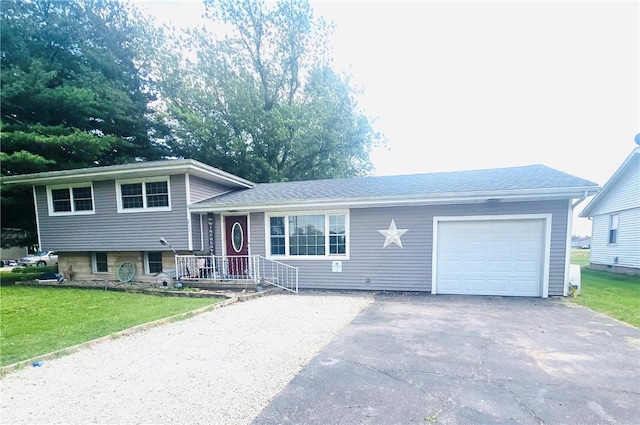 211 E 5th Ave, Rankin, IL 60960 - tri-level home featuring an attached garage, driveway, and a front yard