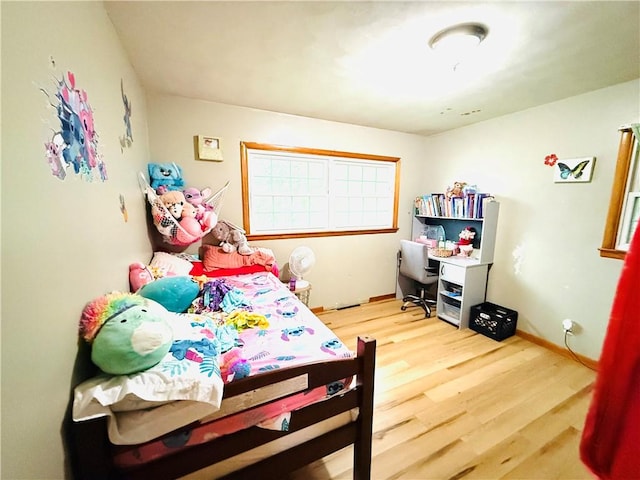 211 E 5th Ave, Rankin, IL 60960 - bedroom featuring wood finished floors and a desk