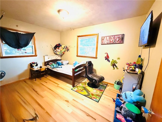 211 E 5th Ave, Rankin, IL 60960 - bedroom featuring wood finished floors and baseboards