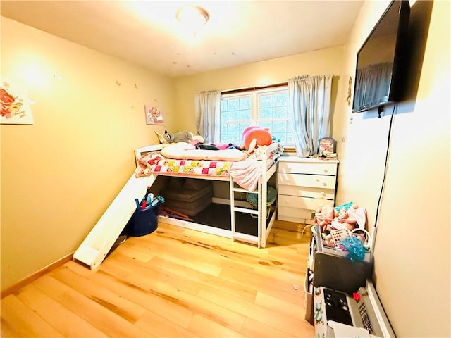 211 E 5th Ave, Rankin, IL 60960 - bedroom featuring wood finished floors