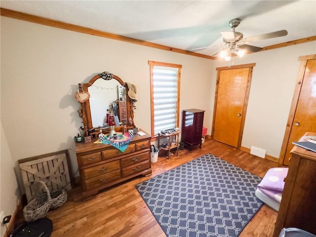 16781 E 1600th Ave, Palestine, IL 62451 - bedroom with light wood finished floors, ornamental molding, a ceiling fan, and baseboards