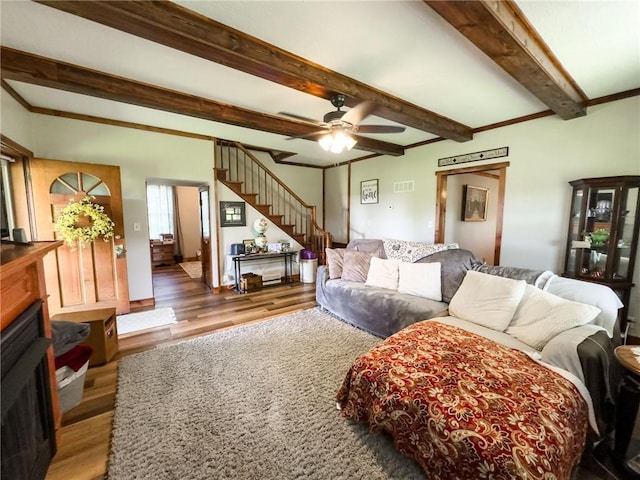 16781 E 1600th Ave, Palestine, IL 62451 - living room featuring wood finished floors, stairway, beam ceiling, and ceiling fan