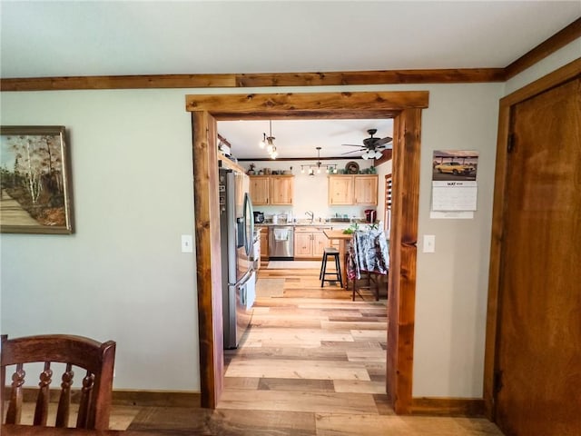 16781 E 1600th Ave, Palestine, IL 62451 - hallway with light wood-type flooring, a sink, and baseboards