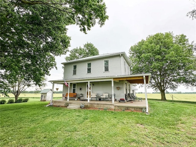 16781 E 1600th Ave, Palestine, IL 62451 - rear view of property with a lawn and a porch