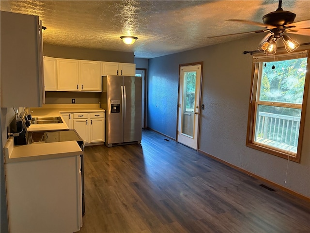 905 Oak St, Edgewood, IL 62426 - kitchen with stainless steel fridge, a textured ceiling, white cabinetry, light countertops, and dark wood finished floors
