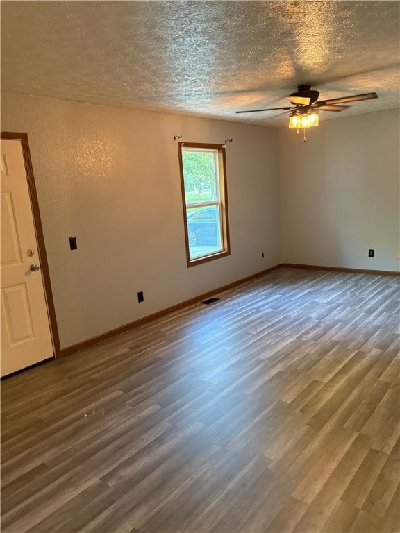 905 Oak St, Edgewood, IL 62426 - empty room with a textured ceiling, wood finished floors, and ceiling fan