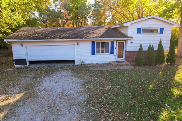 view of front of house with a garage and a front yard