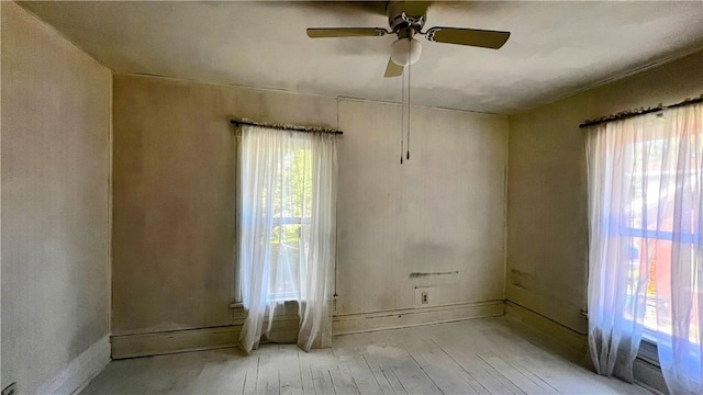 309 N Monroe St, Cerro Gordo, IL 61818 - empty room featuring a ceiling fan and wood finished floors