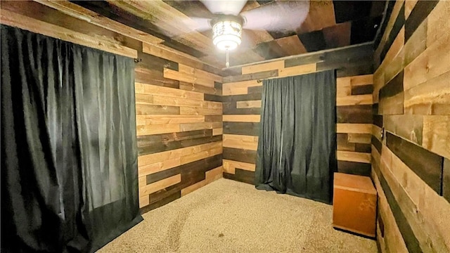 309 N Monroe St, Cerro Gordo, IL 61818 - interior space with wood walls, ceiling fan, and carpet