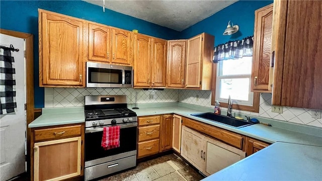 309 N Monroe St, Cerro Gordo, IL 61818 - kitchen featuring appliances with stainless steel finishes, light countertops, and tasteful backsplash