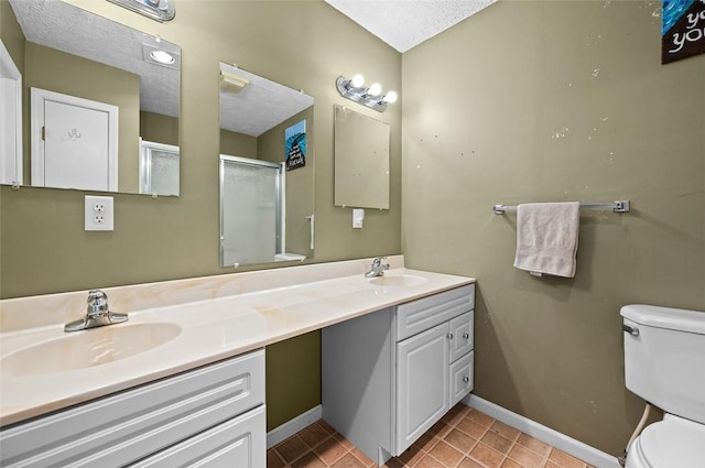 bathroom with toilet, a sink, tile patterned flooring, and a shower stall