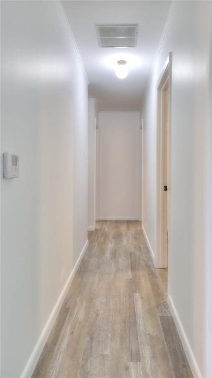1302 Clement Ave, Forsyth, IL 62535 - hallway with light wood finished floors, ornamental molding, and baseboards