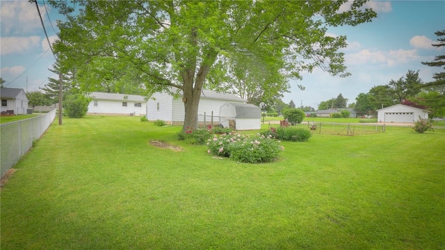 1302 Clement Ave, Forsyth, IL 62535 - view of yard with an outdoor structure and a detached garage