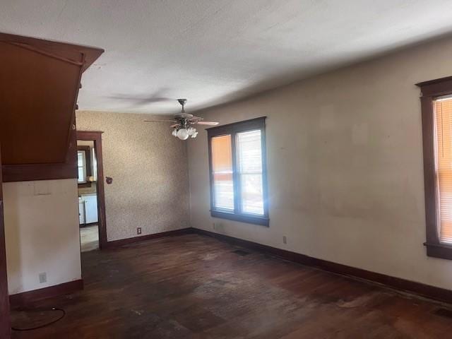 113 S 25th St, Mattoon, IL 61938 - unfurnished room with dark wood-style flooring and a ceiling fan