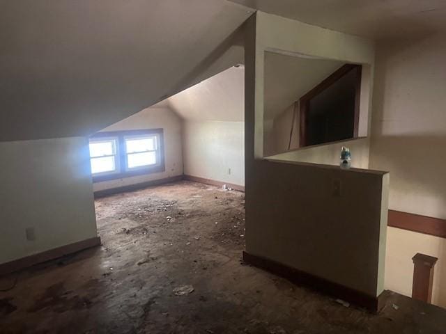 113 S 25th St, Mattoon, IL 61938 - additional living space featuring vaulted ceiling and baseboards