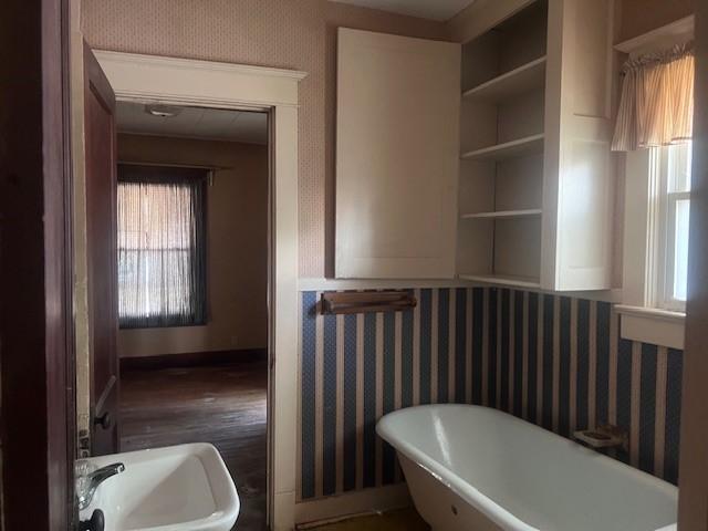 113 S 25th St, Mattoon, IL 61938 - bathroom featuring a freestanding bath and baseboards