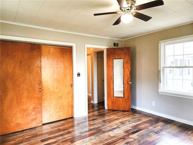89 Pifers Ln, Sullivan, IL 61951 - unfurnished bedroom featuring wood finished floors, ornamental molding, a closet, and ceiling fan