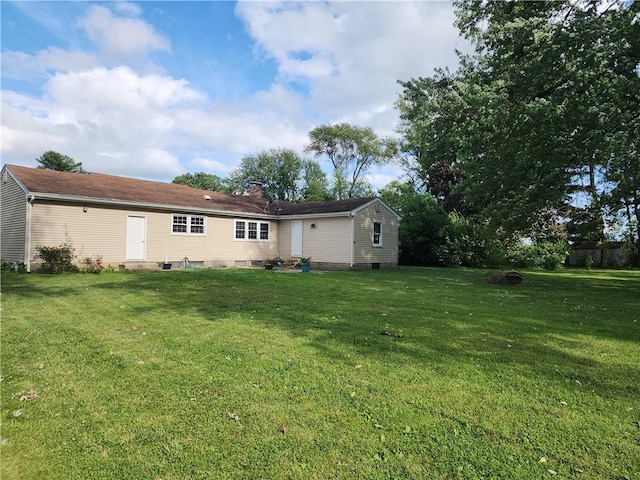89 Pifers Ln, Sullivan, IL 61951 - rear view of house with a lawn and a chimney