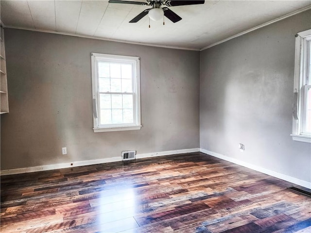 89 Pifers Ln, Sullivan, IL 61951 - spare room with ornamental molding, a ceiling fan, and dark wood-style flooring