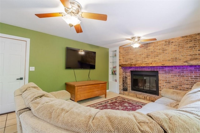 1230 Finley Ave, Mt Zion, IL 62549 - living area featuring tile patterned floors, ceiling fan, built in features, brick wall, and a brick fireplace