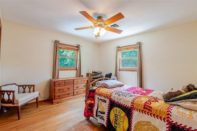 1230 Finley Ave, Mt Zion, IL 62549 - bedroom with multiple windows, light wood-style flooring, and a ceiling fan
