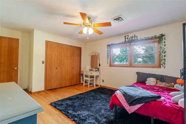 1230 Finley Ave, Mt Zion, IL 62549 - bedroom with wood finished floors, ceiling fan, and a closet