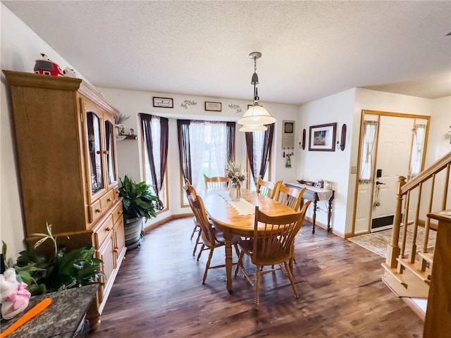 109 Brush Creek Dr, Marshall, IL 62441 - dining space featuring stairway, baseboards, dark wood-style flooring, and a textured ceiling