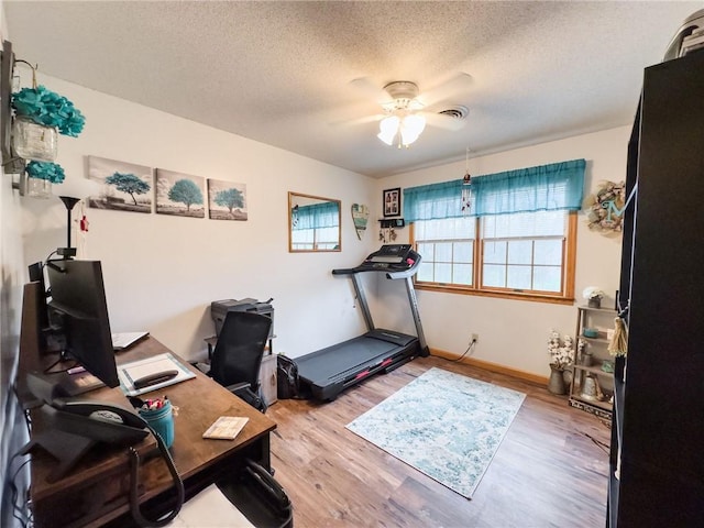 109 Brush Creek Dr, Marshall, IL 62441 - office space featuring a ceiling fan, a textured ceiling, light wood-style flooring, baseboards, and visible vents