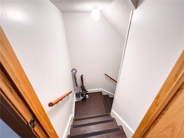 109 Brush Creek Dr, Marshall, IL 62441 - stairs featuring vaulted ceiling, a textured ceiling, and baseboards