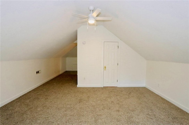 additional living space with ceiling fan, lofted ceiling, baseboards, and carpet floors