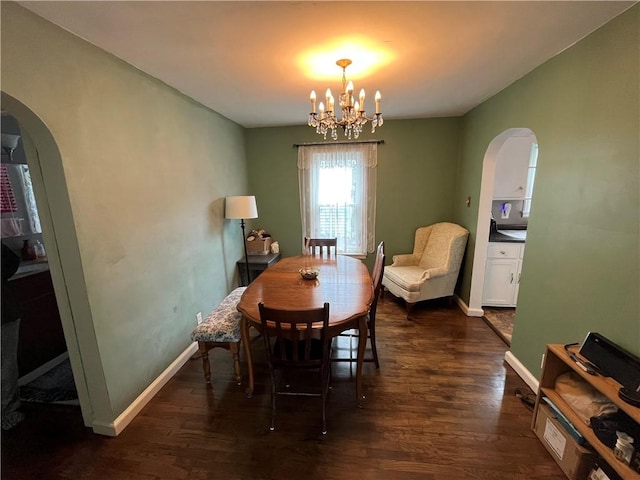 420 N 33rd St, Mattoon, IL 61938 - dining room with arched walkways, dark wood-type flooring, and a chandelier