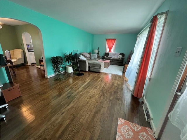 420 N 33rd St, Mattoon, IL 61938 - living room with arched walkways and dark wood finished floors