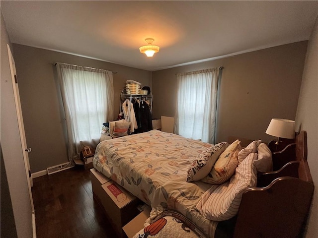 420 N 33rd St, Mattoon, IL 61938 - bedroom with dark wood-type flooring and baseboards