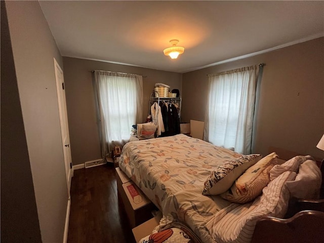 420 N 33rd St, Mattoon, IL 61938 - bedroom with multiple windows and dark wood finished floors