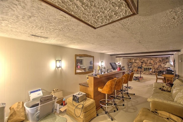 5307 Yavapai Dr, Forsyth, IL 62535 - indoor dry bar featuring a textured ceiling and carpet flooring