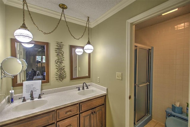5307 Yavapai Dr, Forsyth, IL 62535 - bathroom featuring crown molding, a stall shower, double vanity, and a textured ceiling