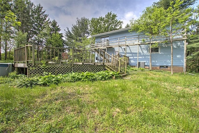 2752 N Sangamon Rd, Decatur, IL 62521 - view of yard featuring a wooden deck, central AC unit, and stairway