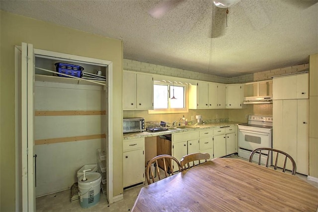 2752 N Sangamon Rd, Decatur, IL 62521 - kitchen featuring white electric range oven, under cabinet range hood, a sink, light countertops, and a textured ceiling