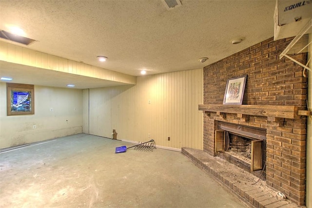 2752 N Sangamon Rd, Decatur, IL 62521 - finished below grade area with a fireplace and a textured ceiling