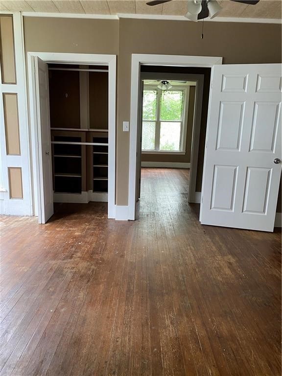 empty room with dark wood-type flooring