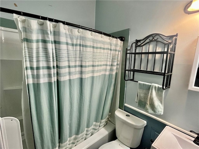 bathroom featuring shower / bathtub combination with curtain and toilet